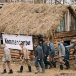 Rogachev, Belarus - February 25, 2017: Re-enactor Dressed As German Wehrmacht Infantry Soldiers Of World War II Leading Re-enactors Dressed As Russian Soviet Prisoners